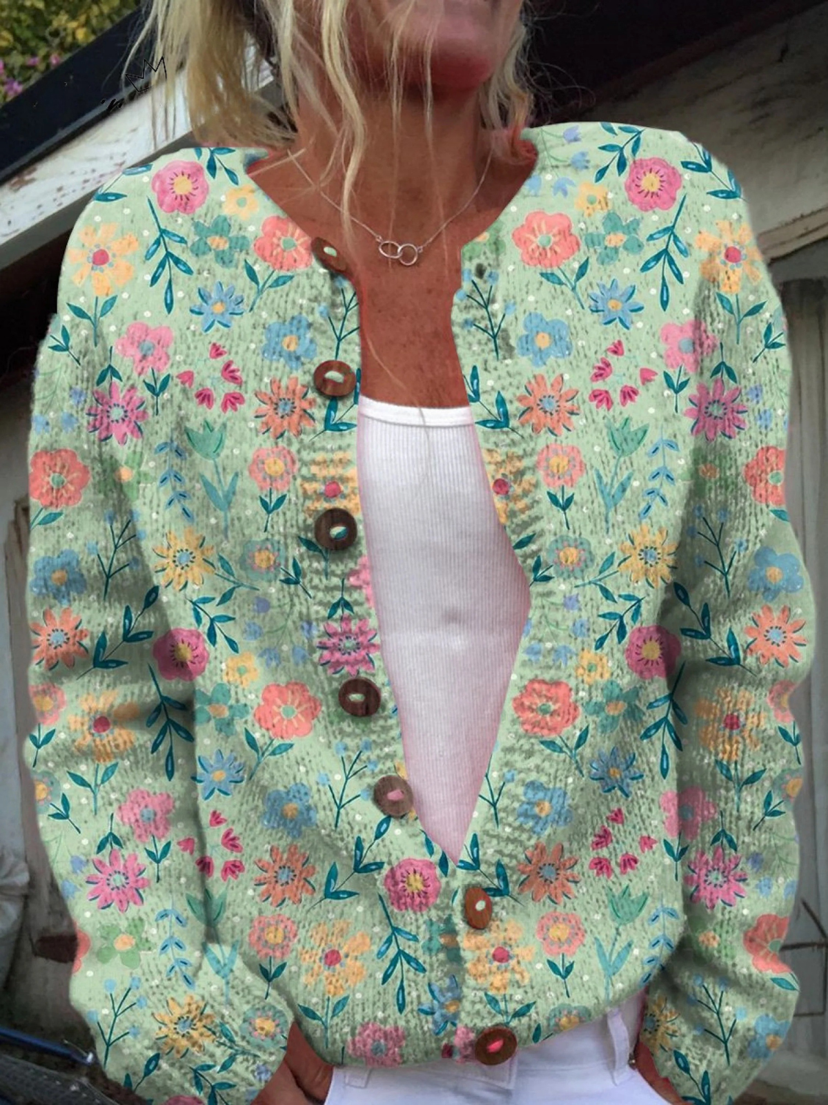 Claudia - Mintgroen vest met kleurrijke bloemen