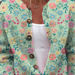 Claudia - Mintgroen vest met kleurrijke bloemen