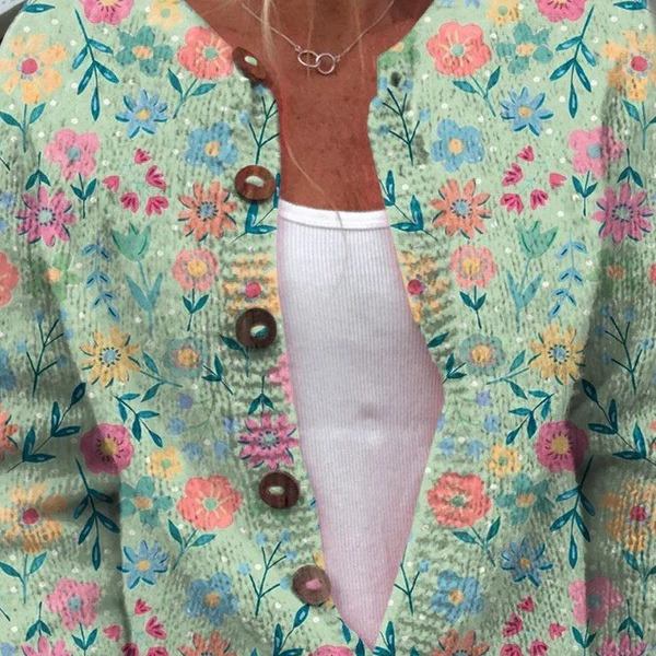 Claudia - Mintgroen vest met kleurrijke bloemen