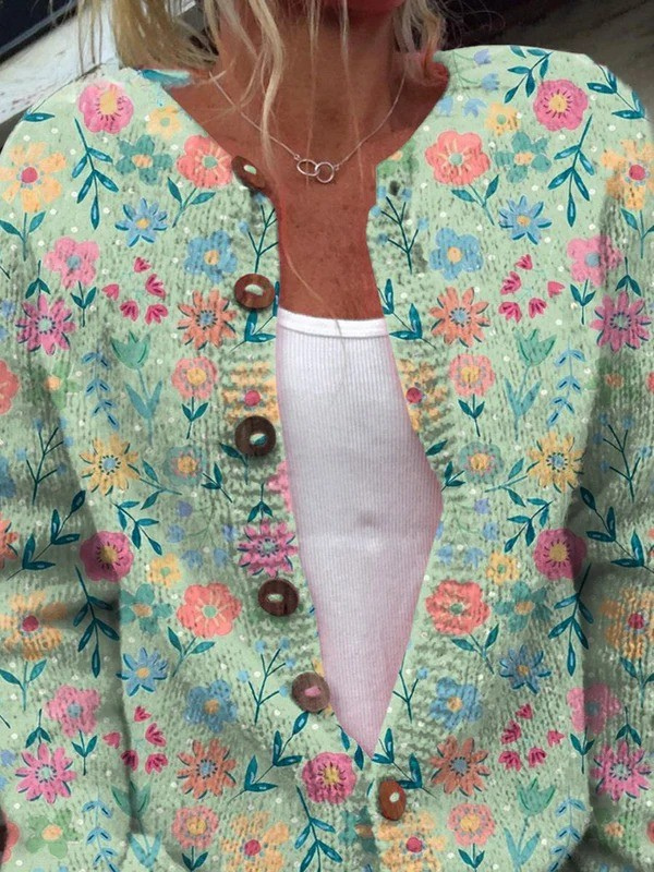 Claudia - Mintgroen vest met kleurrijke bloemen