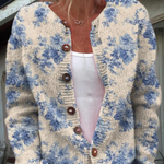 Heike - Crèmekleurig vest met blauwe bloemen