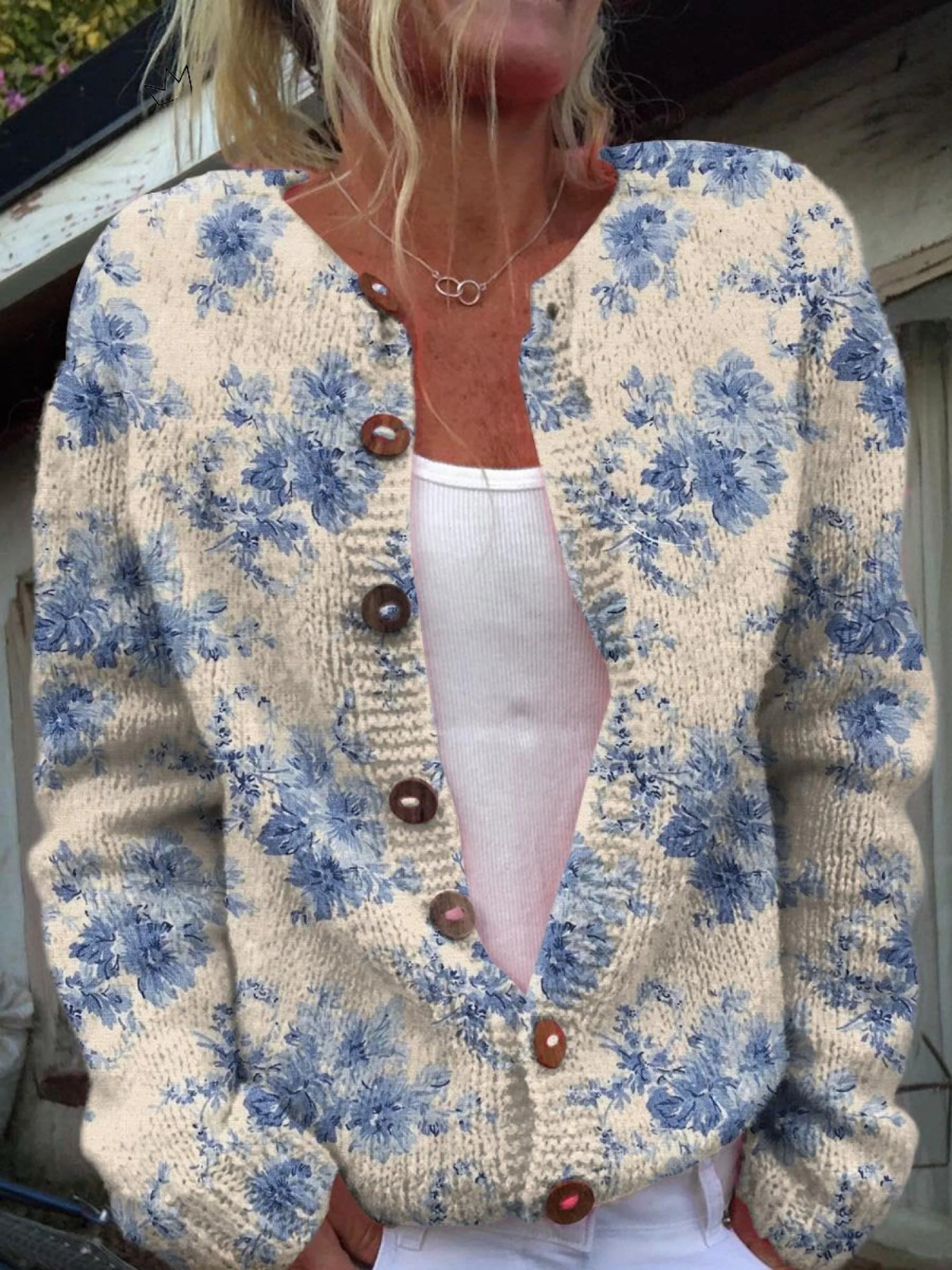 Heike - Crèmekleurig vest met blauwe bloemen