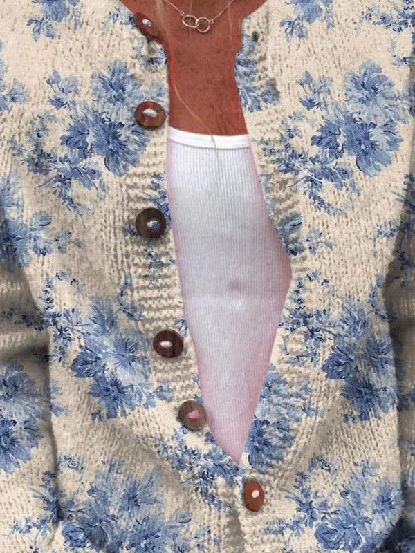 Heike - Crèmekleurig vest met blauwe bloemen