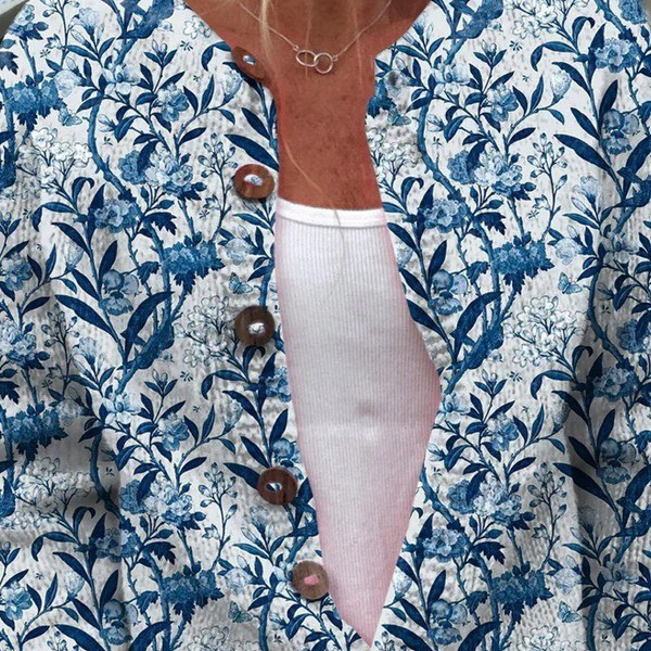 Ingrid - Blauw-wit vest met bloemen & vogels